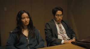 Anna Sawai stars as Emi and Young Mazino as Marquis Collins in HOW TO ROB A BANK, from Amazon MGM Studios.Photo credit: Megan Schoenbachler© 2026 Amazon Content Services LLC. All Rights Reserved.